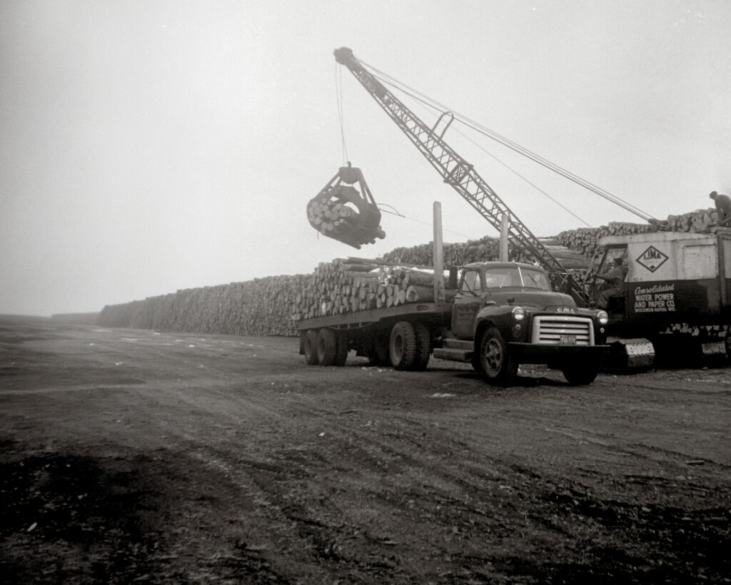 Historic image of jusczak turcking loading logs.